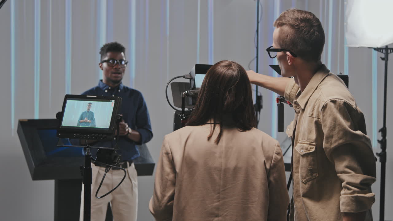 Cameraman And His Team Shooting Video In Studio