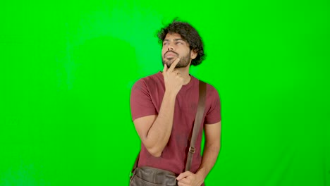 indian-student---tourist-tried-to-find-the-solution-with-green-background---guy-questing-motion-with-green-background