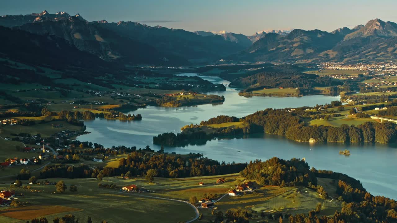 Scenic sunset over mountains and lake reveals stunning landscape
