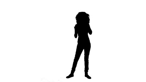 silhouette of a woman talking on her phone