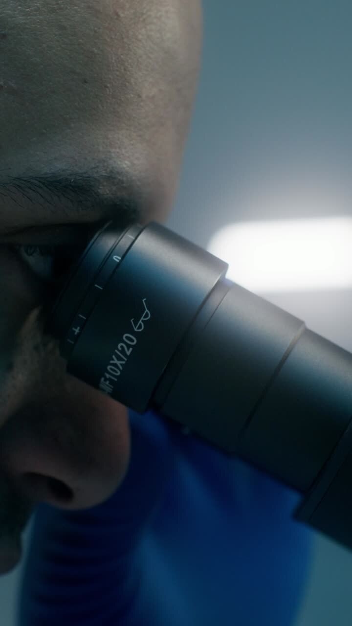 Scientist using a Microscope