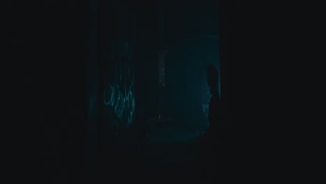 dark abandoned corridor with graffiti