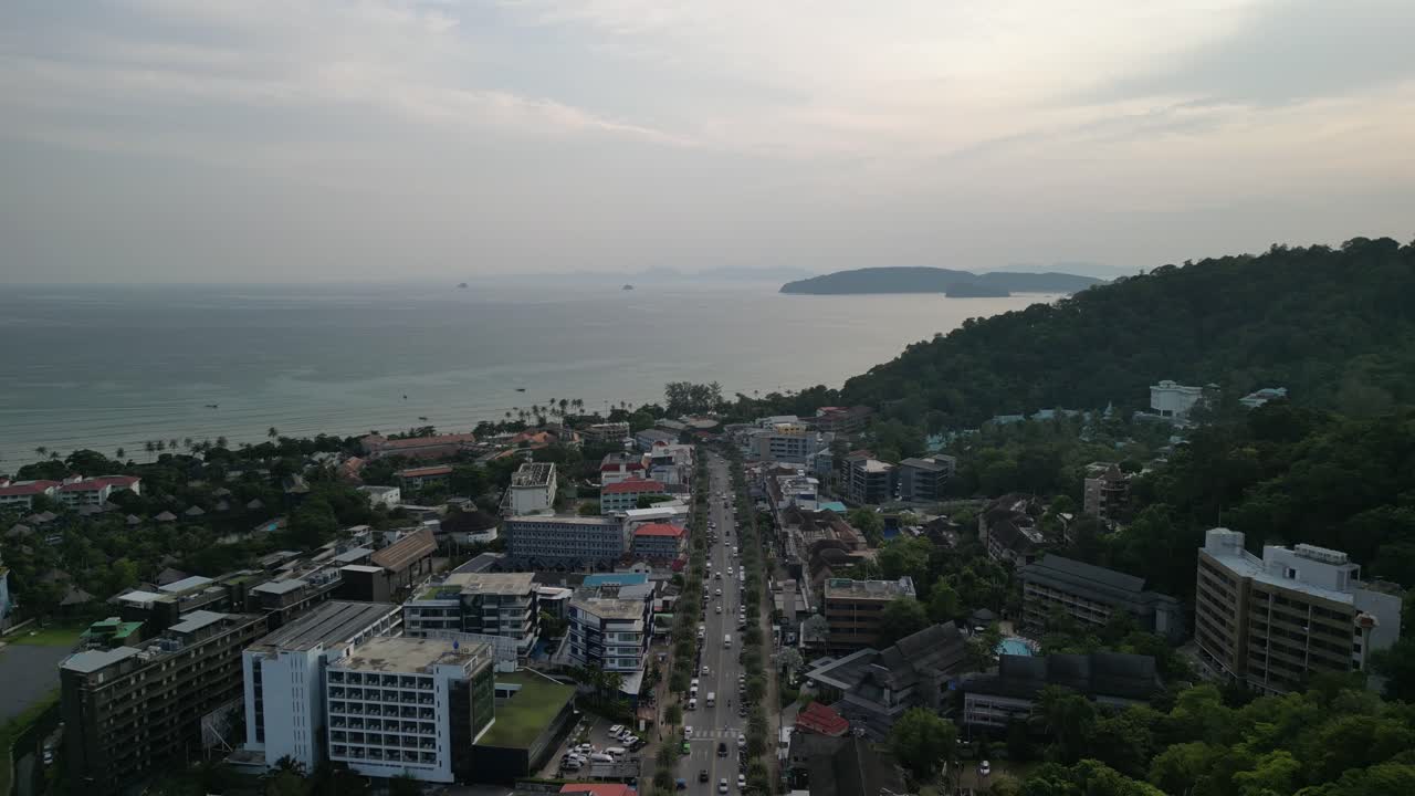 Drone footage capturing Ao Nang beach and town in Krabi, Thailand, showcasing turquoise waters, limestone cliffs, boats, and tropical landscapes.