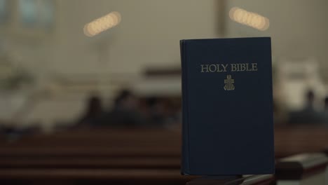 holy bible resting in church - blurred background