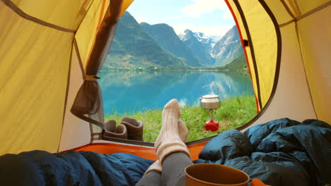 camping in norway, serene lake view from the tent.