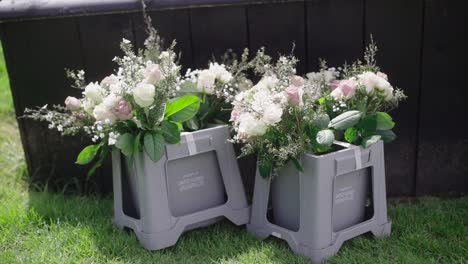 two branches of bridesmaid flowers on the lawn