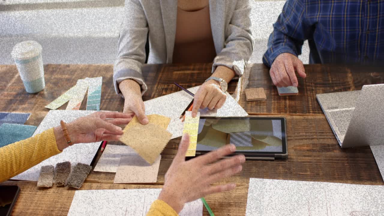 Design team reaching for tiles, starting tablet overlay showing swatch and lining cubes for choice
