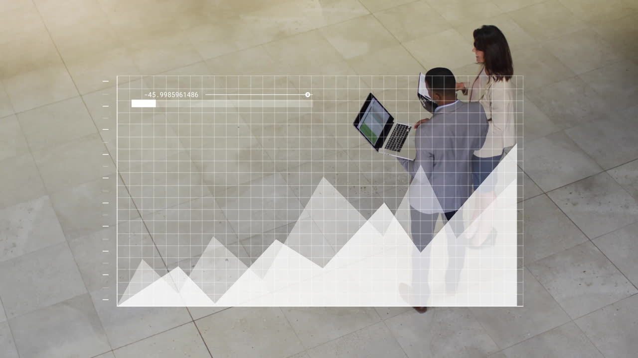 Business professionals analyzing data on laptop with graph animation overlay