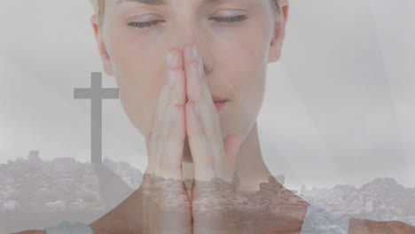 praying, woman with hands together, cross and landscape in background