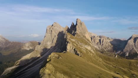 amazing aerial flight above seceda mountain range in italian dolomites