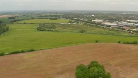 descending aerial shot over varied english farmlands