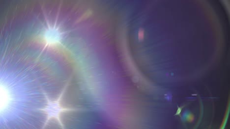 animation of spotlight with lens flare over dark background