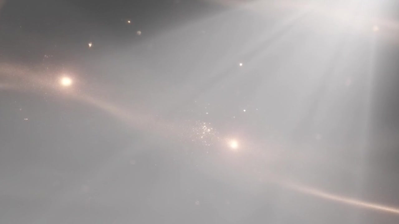 Abstract Background with Floating Particles and Soft Light Rays