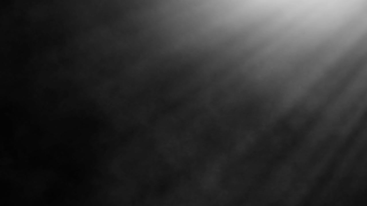 Loopable smoke illuminated by light rays on black background for video overlay and compositing effects