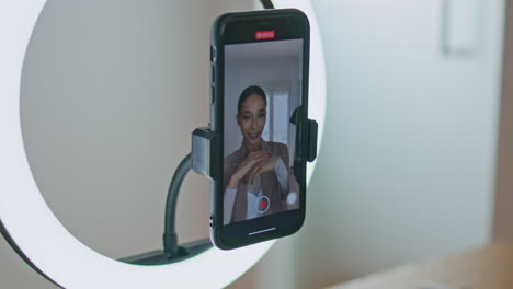 beauty blogger started recording video phone view. woman greeting at apartment