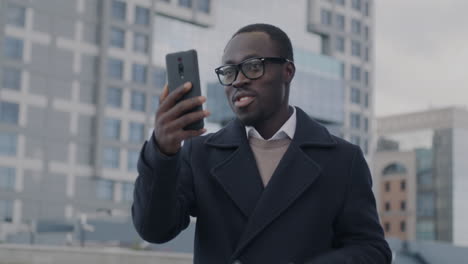 man having a video call in the city