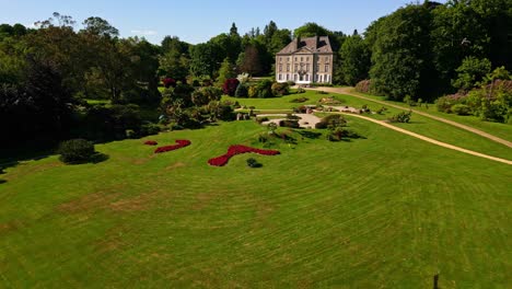 chateau de la foltiere, parc de haute bretagne, france. aerial forward at low altitude, lateral view