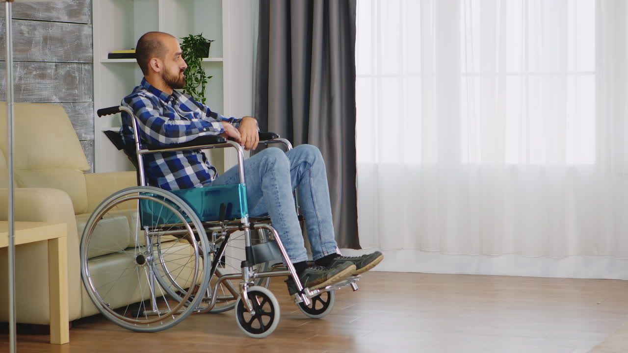 Unhappy man in wheelchair