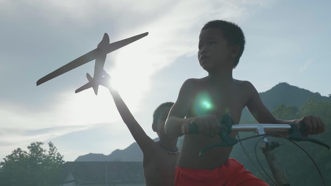Children Playing with Kite and Bicycle