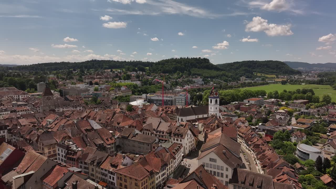 Drone view on a sunny day over the city of Aarau, Kanton Aargau, Switzerland – rooftops, urban layout, and surrounding landscape clearly visible