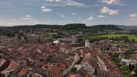 drone view on a sunny day over the city of aarau, kanton aargau, switzerland – rooftops, urban layout, and surrounding landscape clearly visible