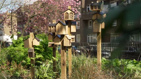 Slow-motion-shot-of-bee-housees-with-trees