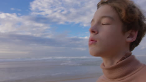 pensive boy at the beach