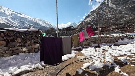 cloths drying in the icy valley of kyanjin gompa