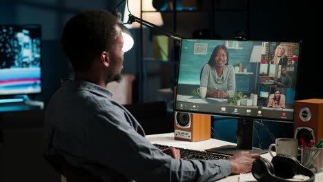 african american remote worker attending a web meeting call in a living room