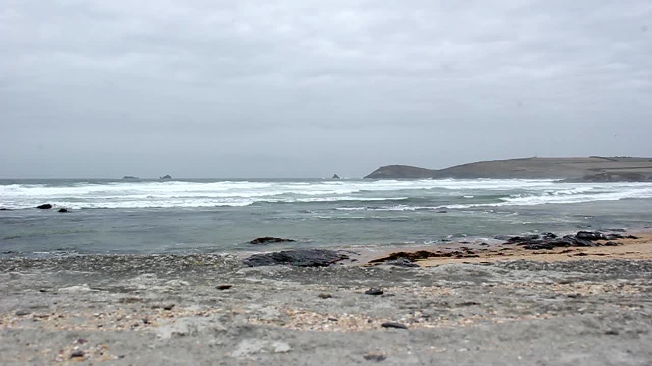 Cloudy beach with ocean waves