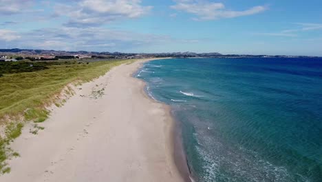 Aerial-view-over-the-beach-and-transparent,-arctic-sea-in-Norway---Bird's-eye,-drone-shot