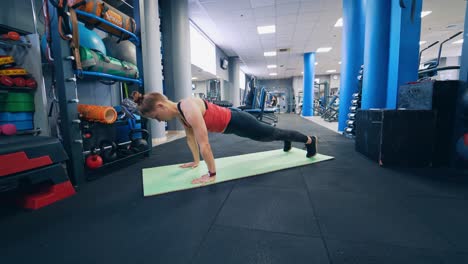 young female exercising on mat. fitness model working out on mat in gym