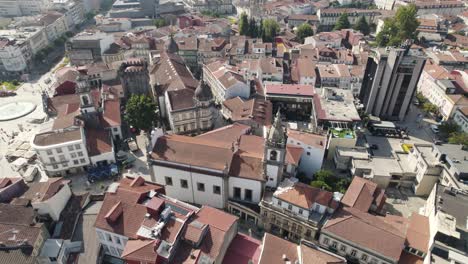 drone top down over braga city centre houses with church and squares - portugal