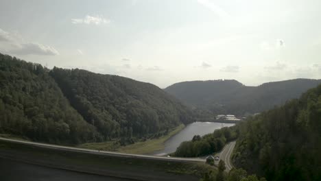 Scenic-Drone-Shot-of-a-beautiful-lake-at-sunset-in-the-Harz-National-Park,-Germany,-Europe