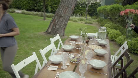 men and women serving table outdoor