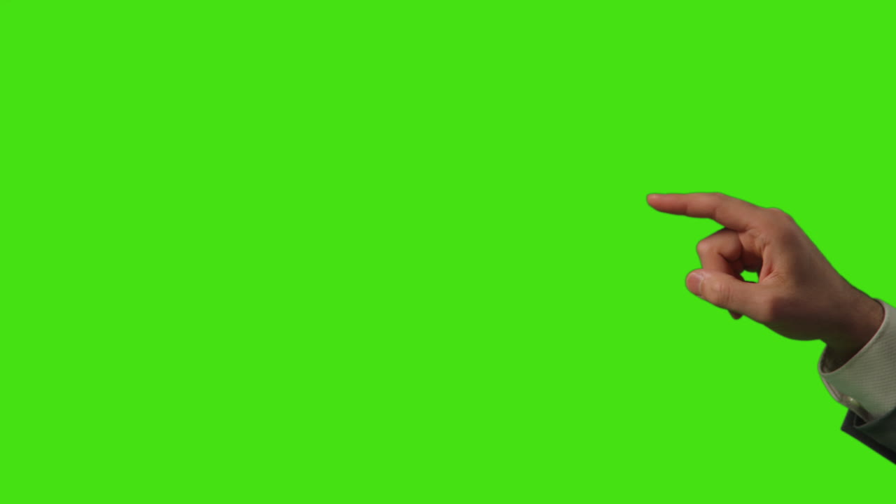 Close Up Of Businessman's Hand Interacting And Making Control Gestures When Using Virtual Reality Technology Against Green Screen