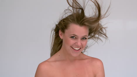 smilling woman shaking her hair