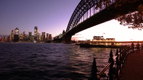 view of sydney city, the opera house and the harbour bridge at sunset from milsons point.