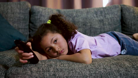 kid watching film at home