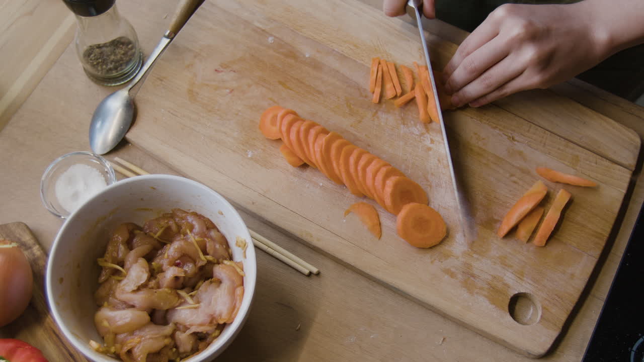 Cooking Stir Fry: Chopping Carrots and Preparing Chicken