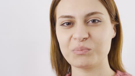 close-up of woman eating watermelon jelly.