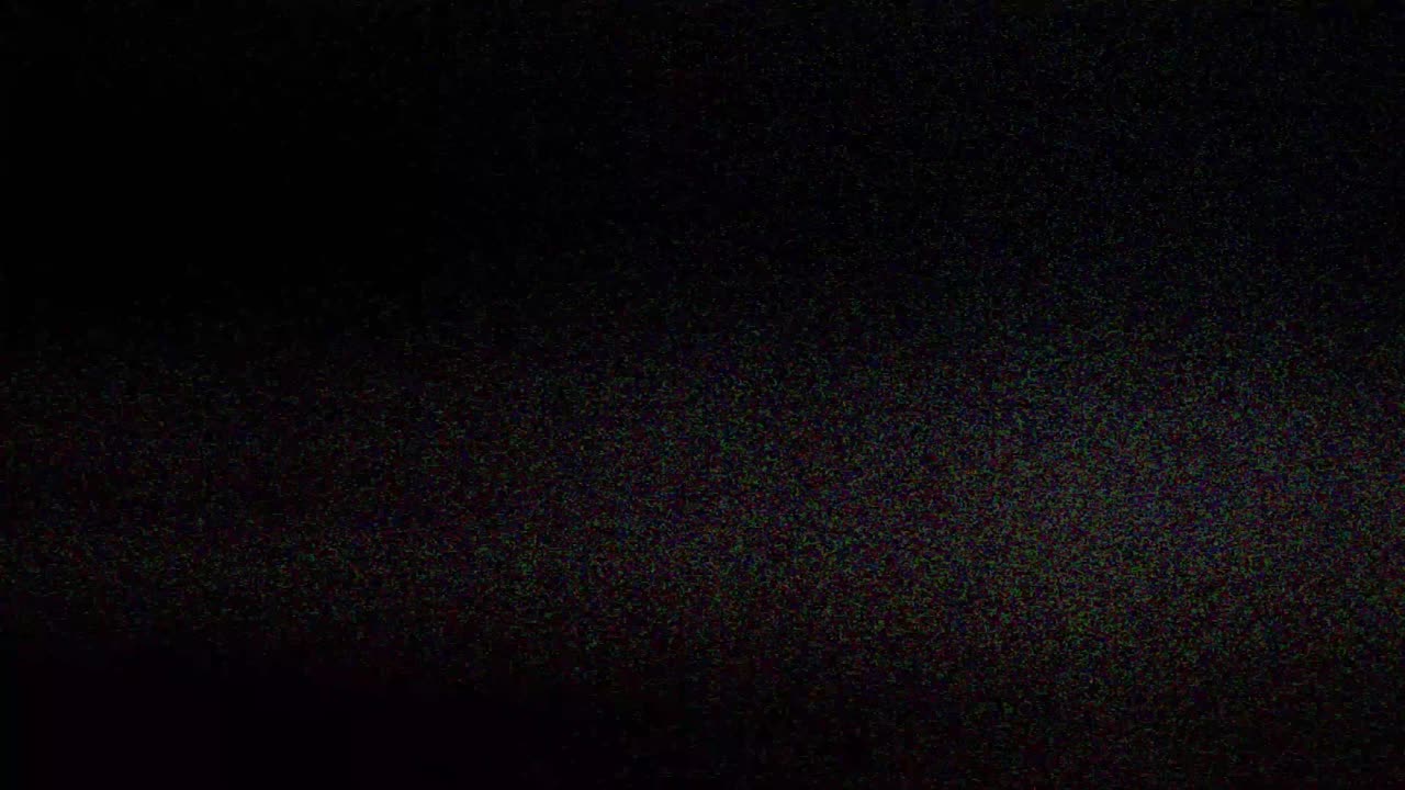 Authentic VHS tape noise with color bleeding, scan lines, and static glitch effects. Seamless loop for creating a retro 80s or 90s television look. Use as an overlay or background