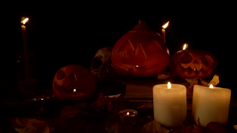 halloween decorations jack's lanterns and skull in candlelight, loope video