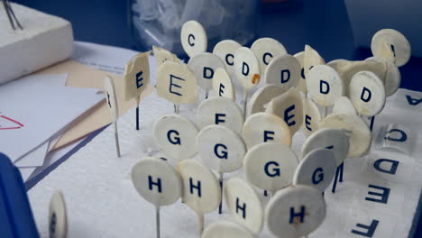 a college science laboratory desk with markers to keep track of data samples during an experiment for the students