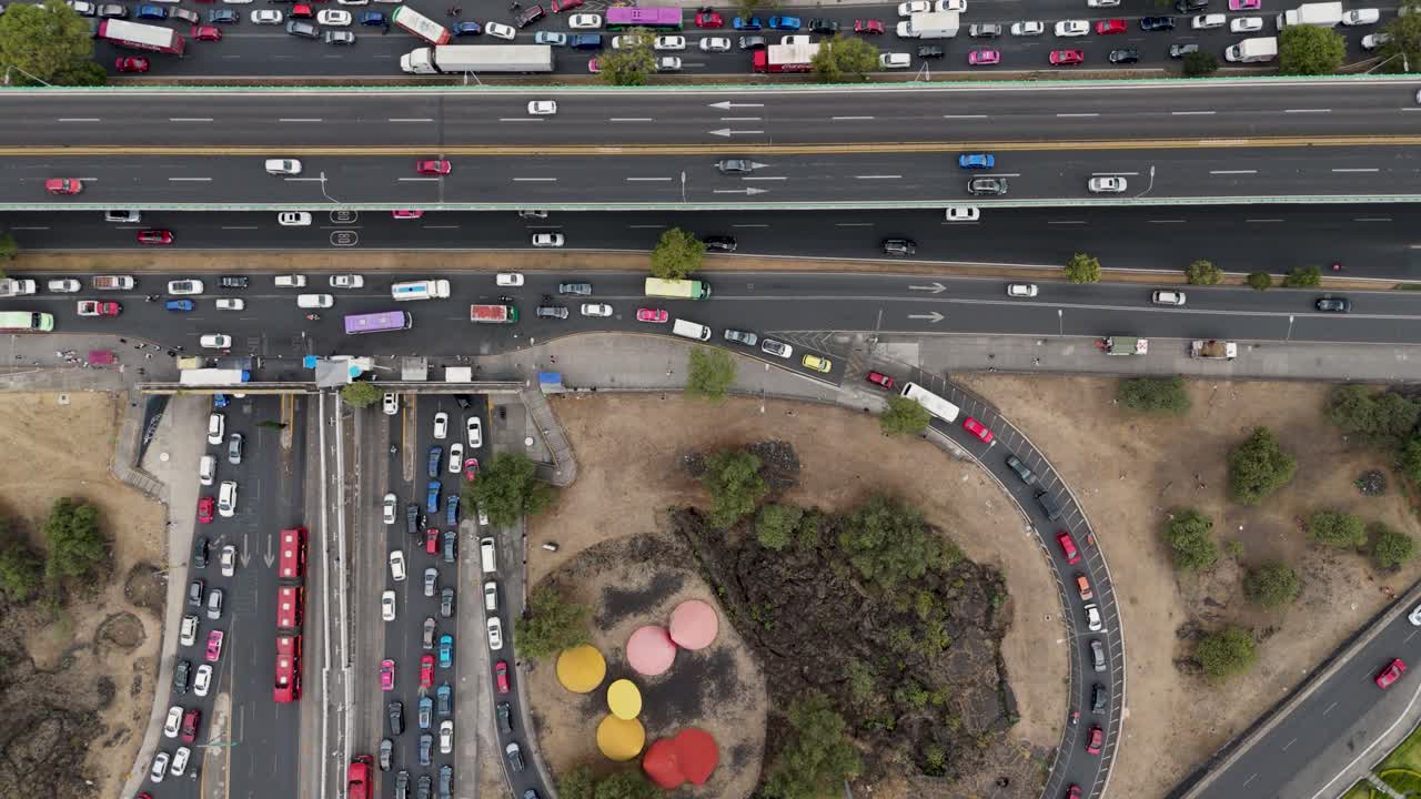 Traffic jam at a cloverleaf interchange on an arterial road in CDMX, drone shot