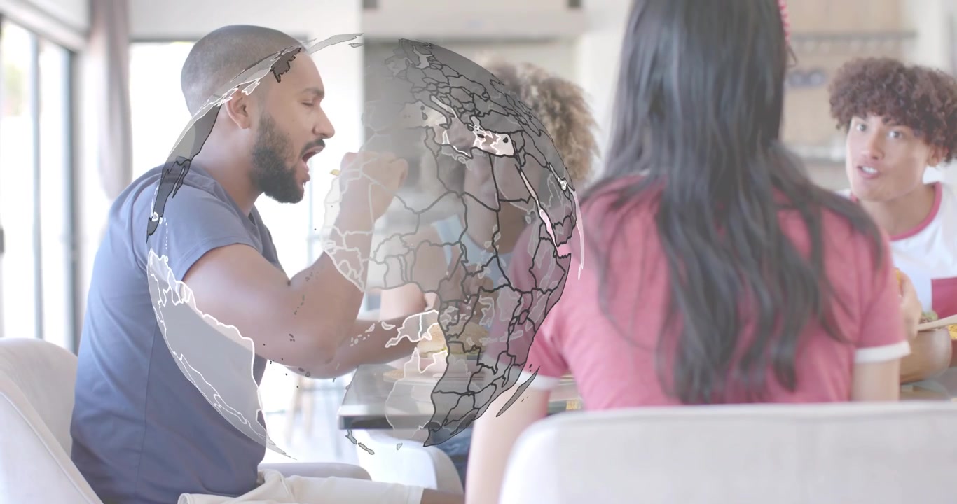 Homem barbudo pegando batatas fritas, ativando um globo giratório que varre a mesa, ilustrando a conexão tecnológica global.