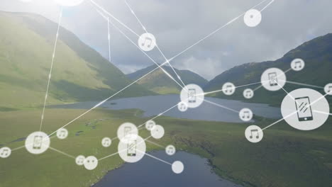 animation of connected icons over aerial view of lakes between mountains against cloudy sky