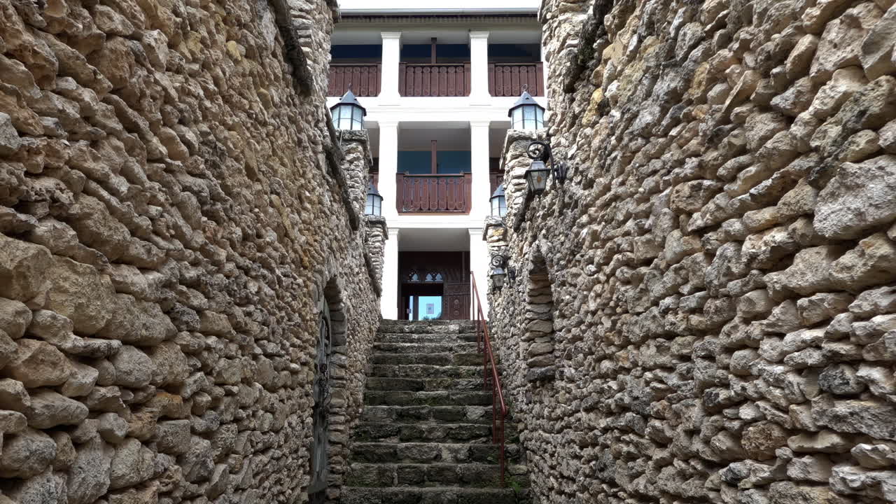 Old, stone walls at the entrance of a restaurant in Orhei, Moldova