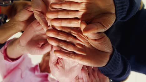 group of people forming handstack 4k