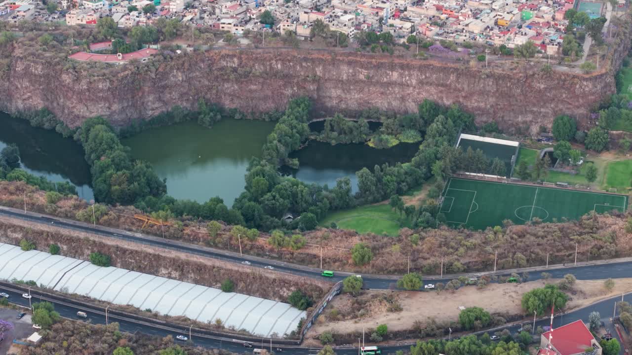 Drone view of a water reservoir inside a megacity
